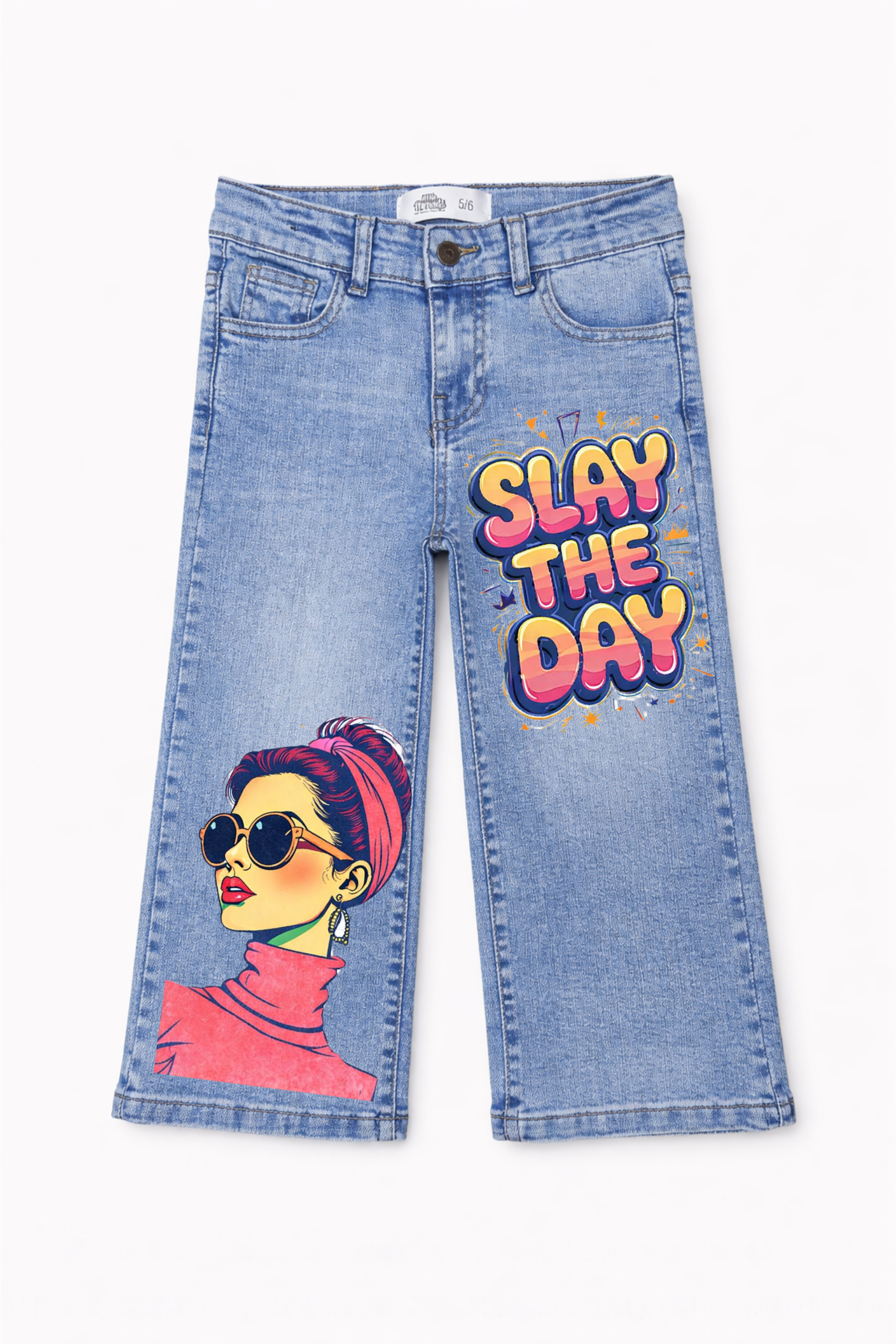 Blue jeans with a graphic design of a woman and 'Slay the Day' text on a white background