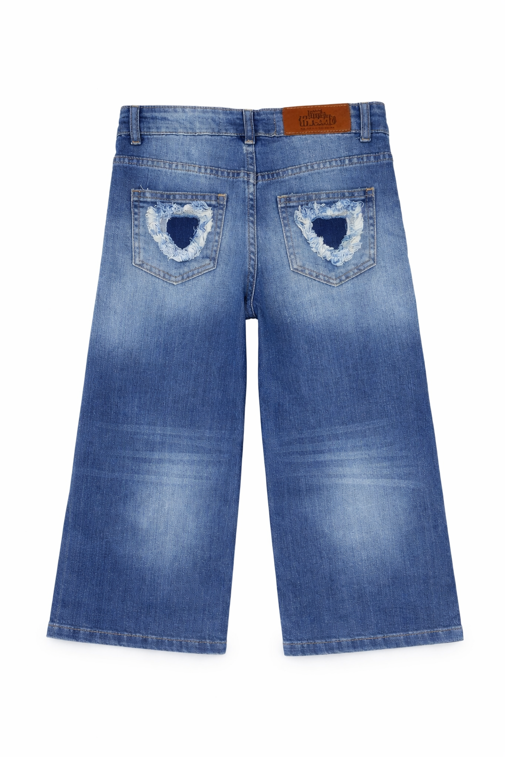 Blue jeans with heart-shaped cutouts on the back pockets on a white background