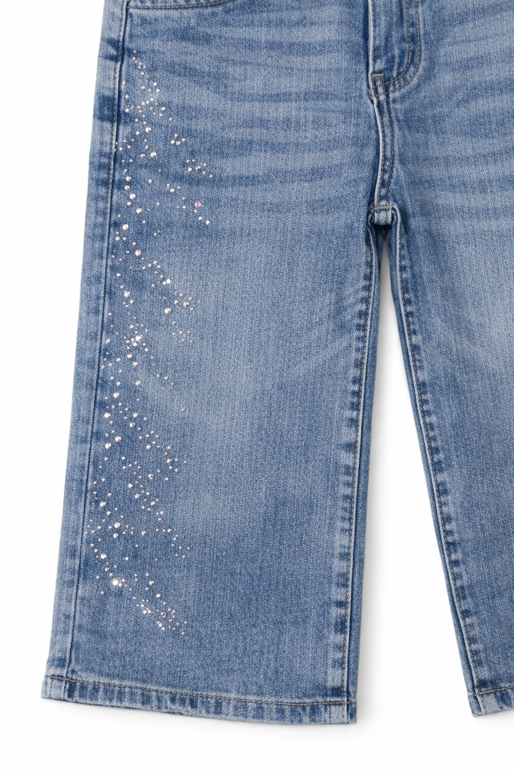 Blue jeans with glittery accents on a white background